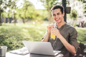 Man drinking his fruit juice